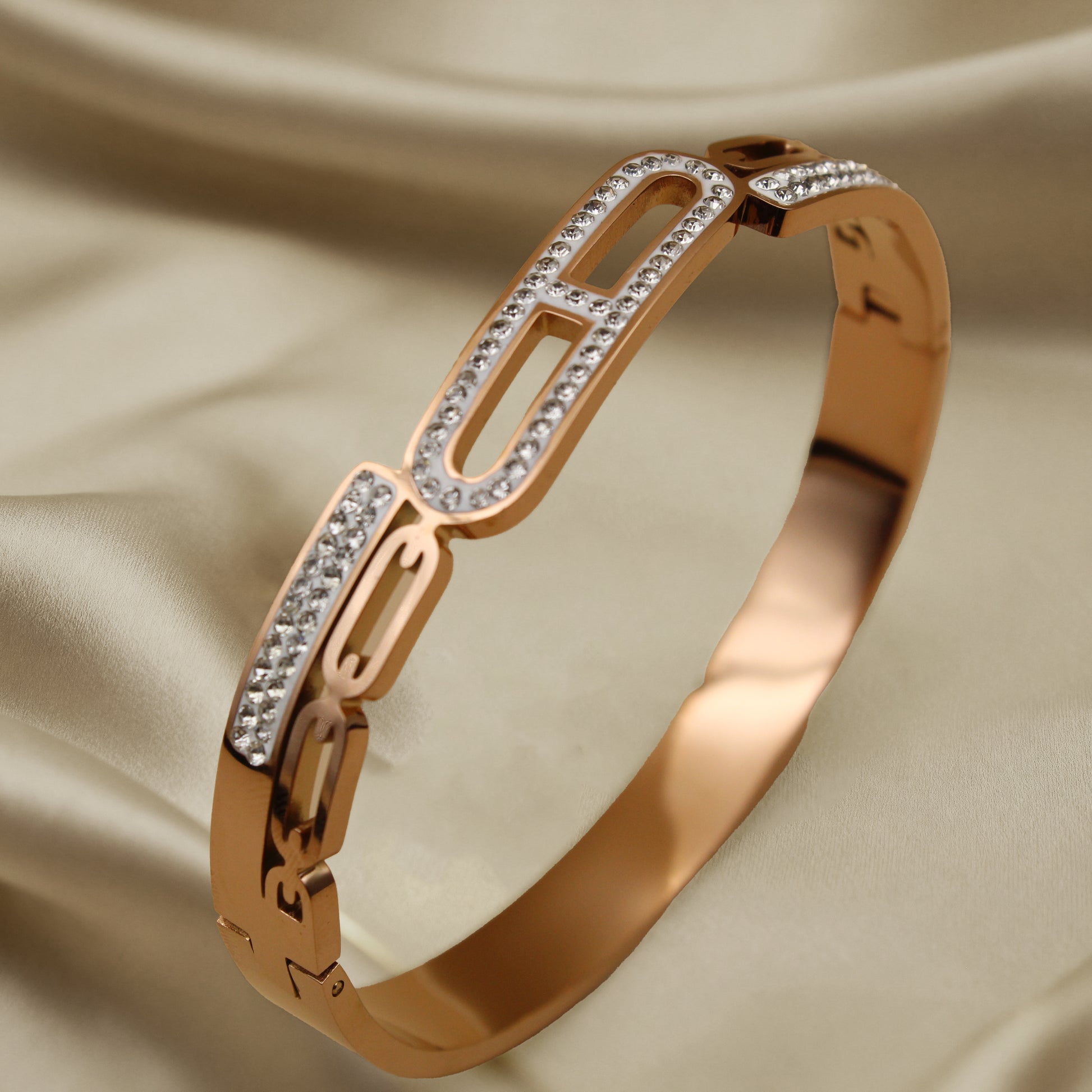 Contemporary Gold Tone Bangle with Linked Crystal Pattern
